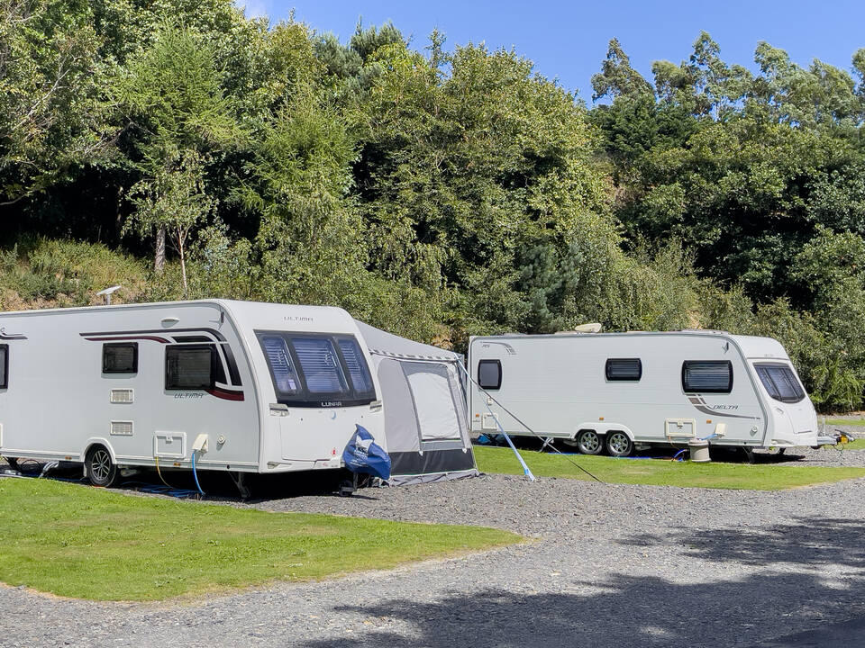 Caravans in field